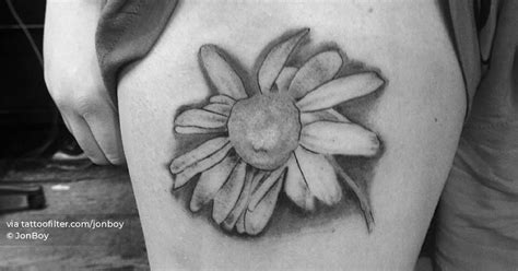 Daisy Flower Tattoo Located On The Thigh