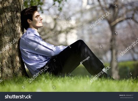 businessman leaning  tree resting stock photo  shutterstock