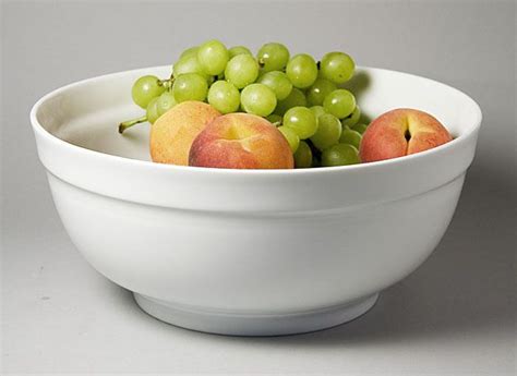 white bowl filled  grapes  apples