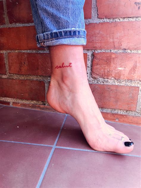 tattoo word in red ink on ankle red ink tattoos red tattoos ankle tattoo