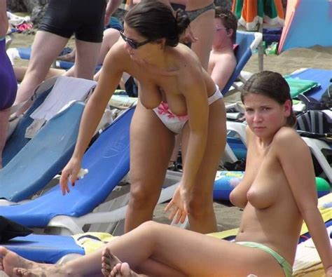 topless hotties with awesome boobs exposed on candid beach nude girls beach