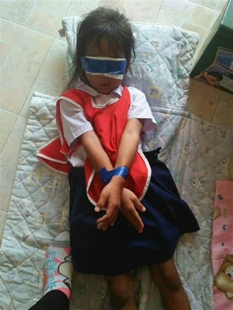 teachers bound and blindfold two five year old girls as