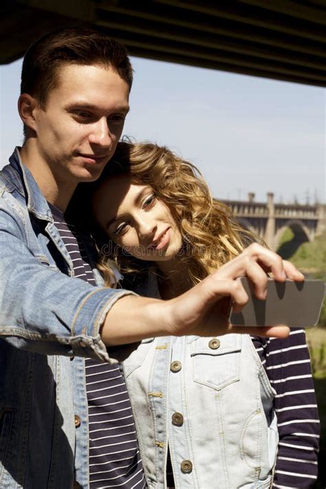 Two Young People Man And Woman Wearing Jeans Outdoors Fashion Concept