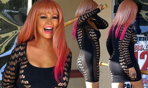 Christina Aguilera Squeezes Her Body Into A Very Little Black Dress To