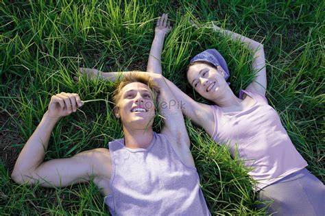 A Couple Lying On The Grass Picture And Hd Photos Free Download On