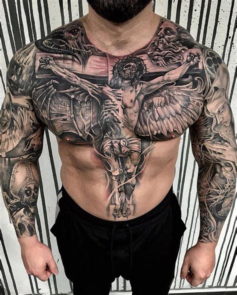 A Man With Many Tattoos On His Chest