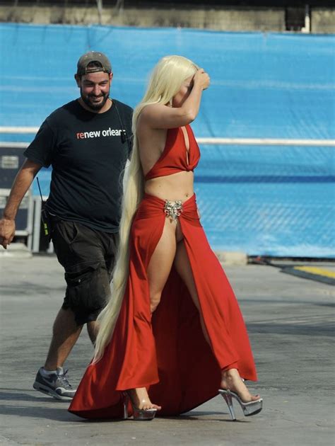 lady gaga flashes her knickers in a striking red gown on