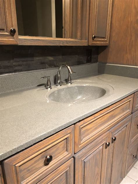 gray washed bathroom cabinets slate backsplash stone spray  epoxy countertop functional