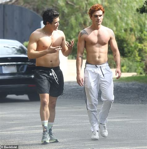 kj apa and his riverdale co star charles melton strip down as they