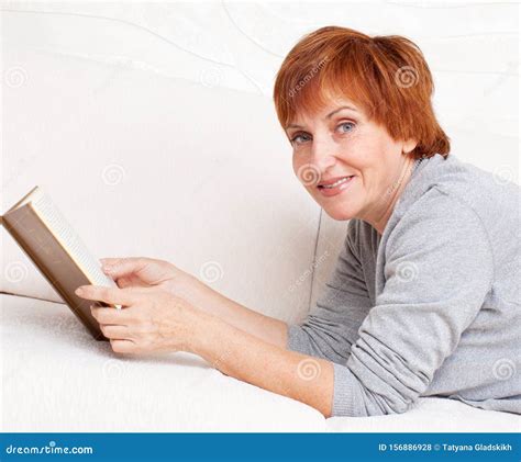 adult woman reading book stock photo image  sensuality