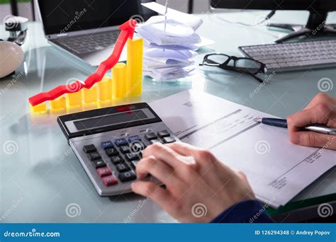 businesspersons hand calculating bill  calculator stock photo image  information