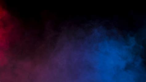 Abstract Blurred Smoke In Red And Blue Colors Over A Black Background