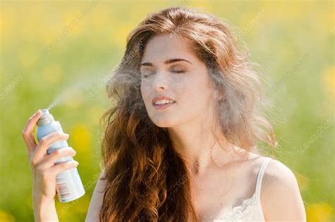 Woman Spraying Water On Her Face Stock Image C032 9578 Science