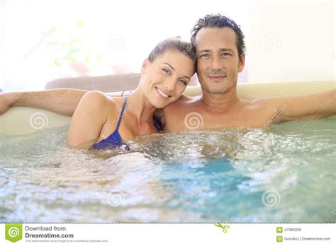 Middle Aged Couple Relaxing And Enjoying The Jacuzzi Stock