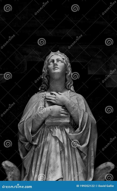abstract shot   female holy figure holding  bible stock photo