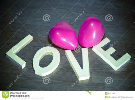 valentine day present love with pink heart balloons wooden background
