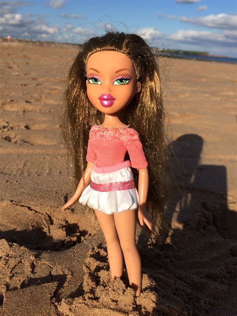close    doll   sand   hair pulled   green eyes