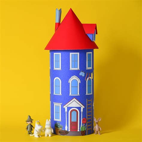 paper house   figurines  front     yellow background