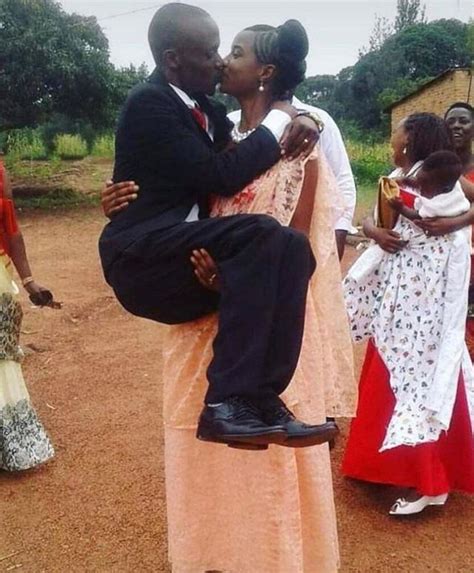 amazing stories around the world wife carries and kisses her husband in viral wedding photo