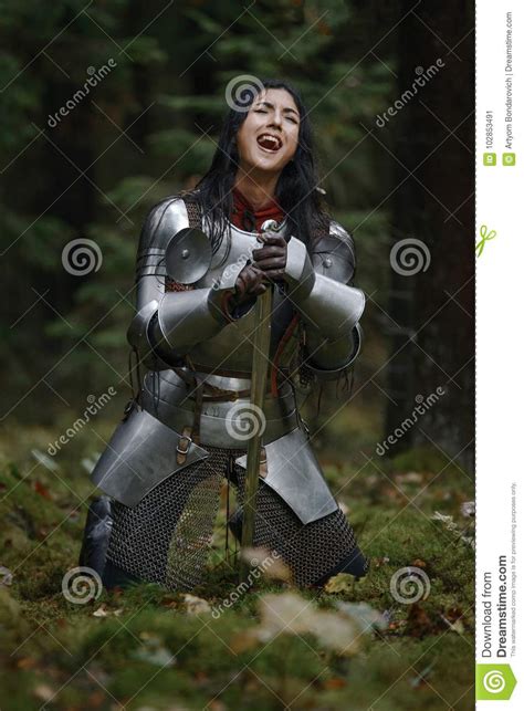 A Beautiful Warrior Girl With A Sword Wearing Chainmail