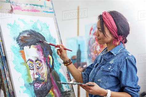 female artist painting  art studio stock photo dissolve