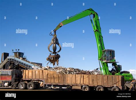 electromagnetic crane lifting scrap steel  recycling   stock photo royalty  image