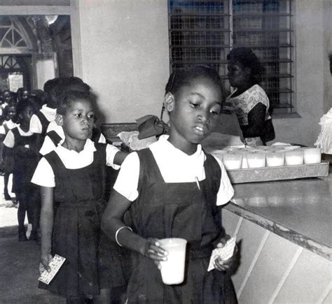 A Piece Of Our Past Primary School Girls Being Served With Milk And
