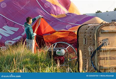 Adult Man Filling A Hot Air In Balloon Ballooning Is A Growing