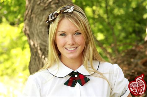 hot teen in super sweet schoolgirl outfit smiles and shows