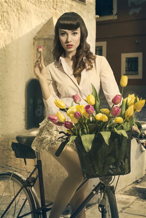 retro pin up on bike in old town with tulips stock image image of hair lady 31242279