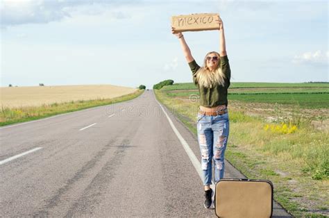 Beautiful Girl Hitchhiking On The Road Traveling Stock Image Image Of
