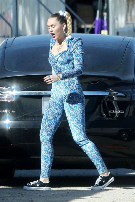 miley cyrus in a blue floral jumpsuit on set of her latest project in la 10 18 2018