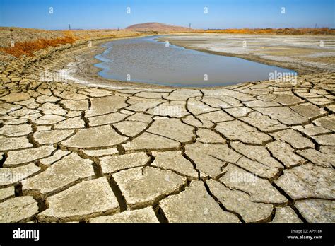 dried  water hole  dried  cracked earth  mud