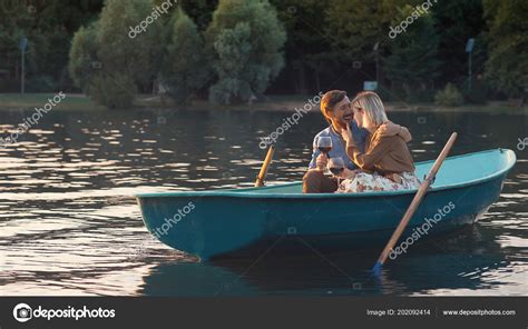 attractive couple boat romantic date stock photo  cdeklofenak