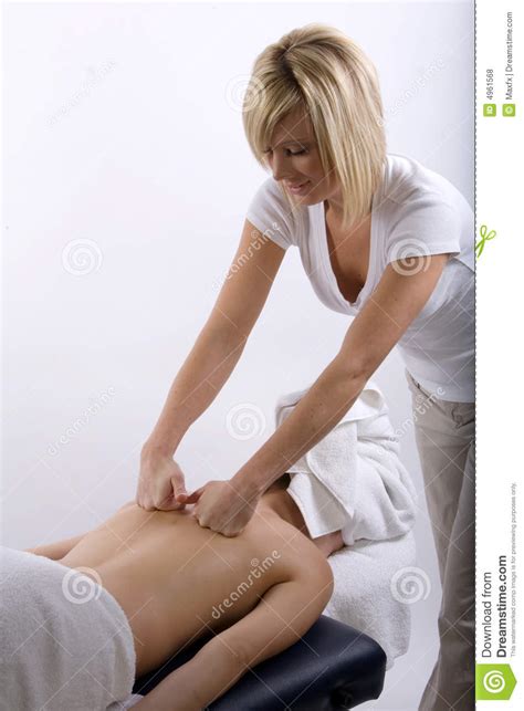 massage therapist giving a massage royalty free stock