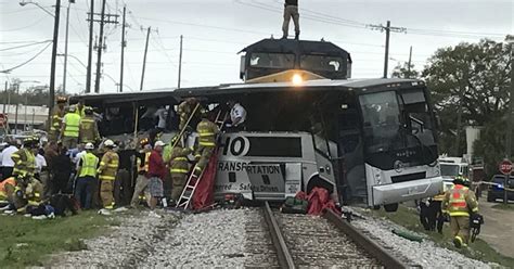 three dead in biloxi after train hits bus pushing it 300ft down track
