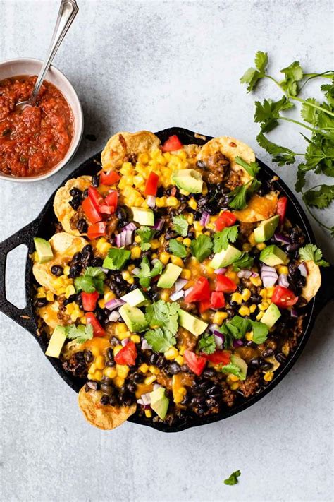 These Skillet Nachos Are Oven Baked In A Cast Iron Pan And Loaded With