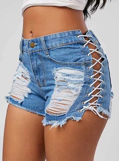 super short denim shorts lace up sides faded and torn blue