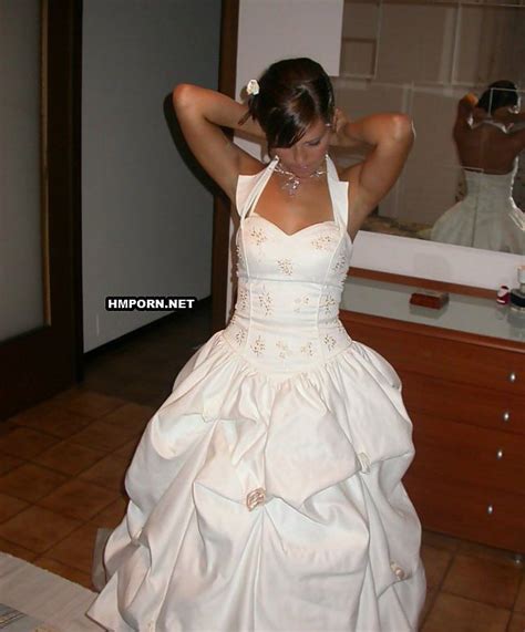 bride takes her wedding dress off after wedding ceremony