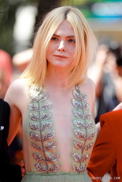 elle fanning paparazzi side boobs shots at 70th cannes film festival