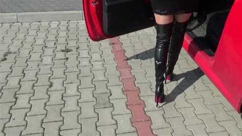smoking hot girl in provocative black boots does some pedal pumping in the sport car feet9