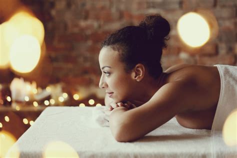 African American Woman Receiving A Relaxing Massage At The Spa Free Photo
