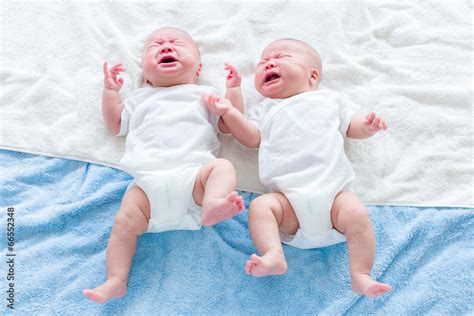 baby twins cry stock foto adobe stock