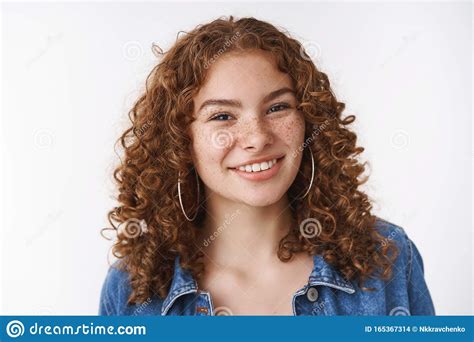 close up attractive confident smiling redhead curly haired girl