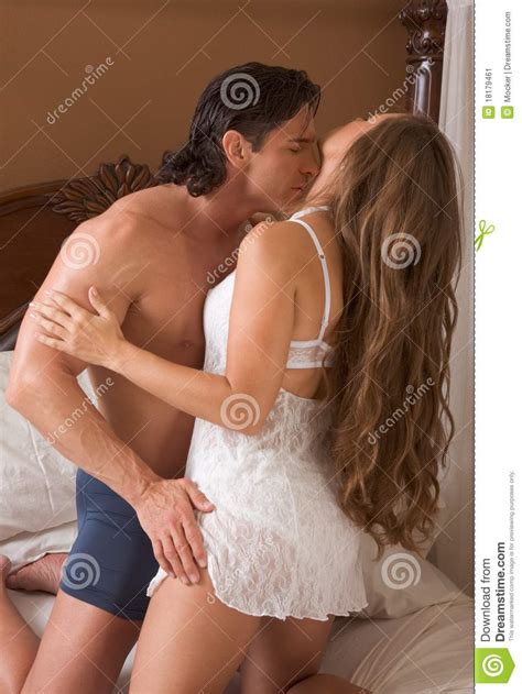 Sensual Heterosexual Couple In Lingerie On Bed Stock Image