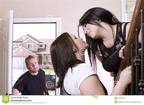 husband coming home finding his wife cheating stock image