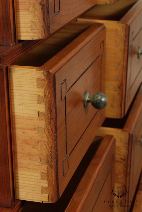 unusual  drawer stacking tall chest  wrought iron base