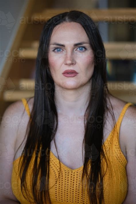 image of trans woman looking at camera austockphoto