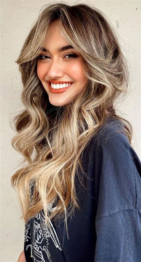 cute haircuts and hairstyles with bangs multi shades of blonde with