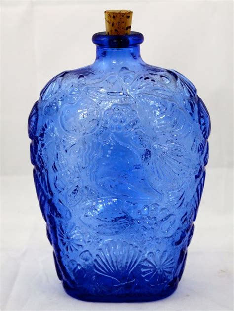 vintage cobalt blue glass bottle  seashell design  etsy